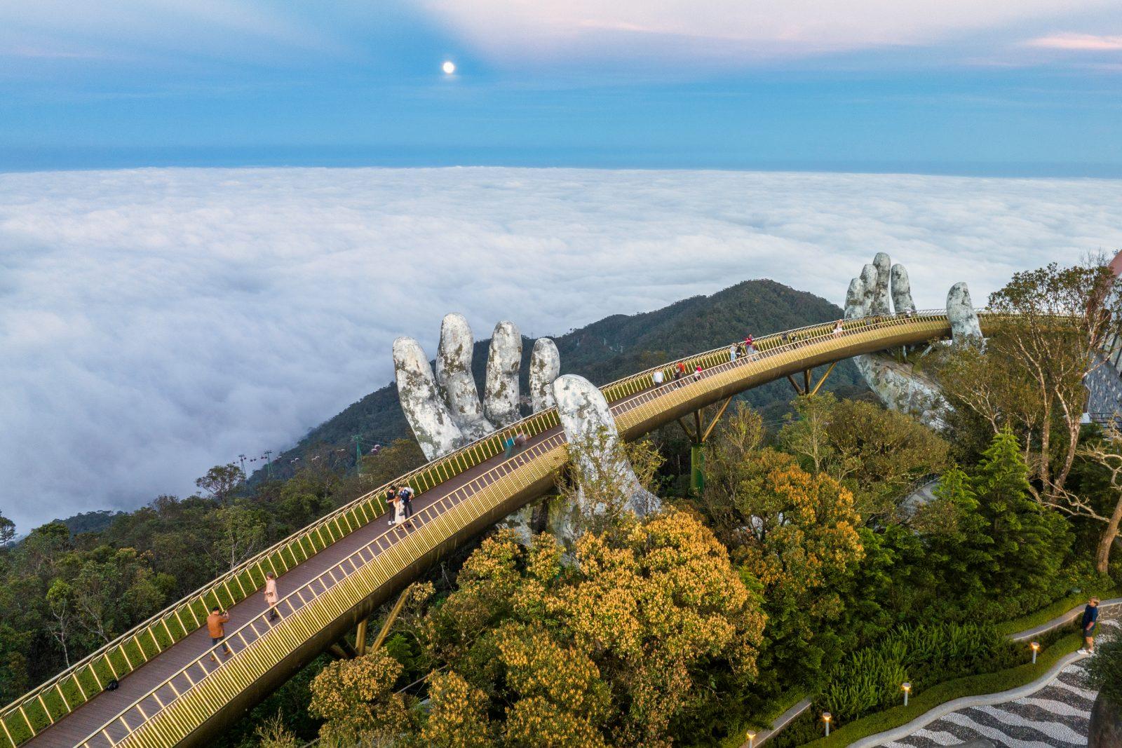 The Golden Bridge held by giant stone hands near Da Nang