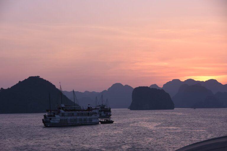 Limestone karsts of Ha Long Bay bathed in sunset light