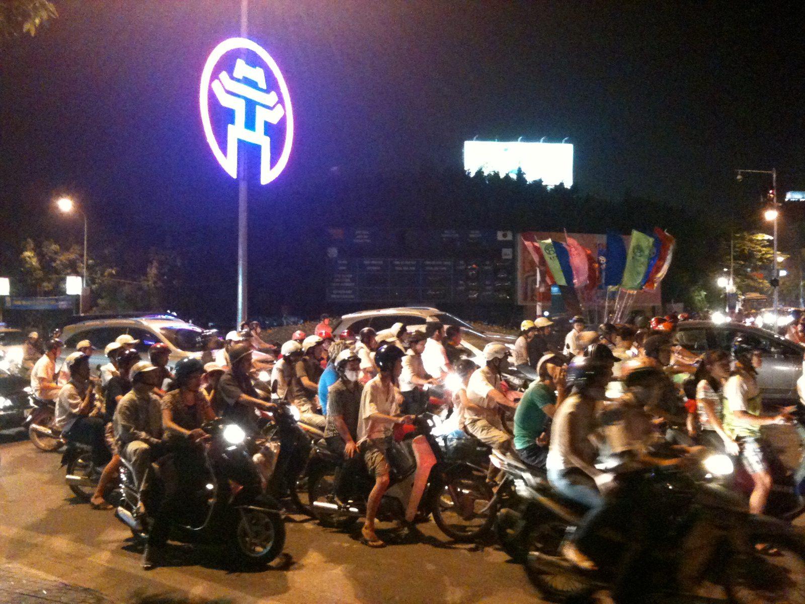 Heavy motorbike traffic on a Hanoi street, a common sight across Vietnamese cities