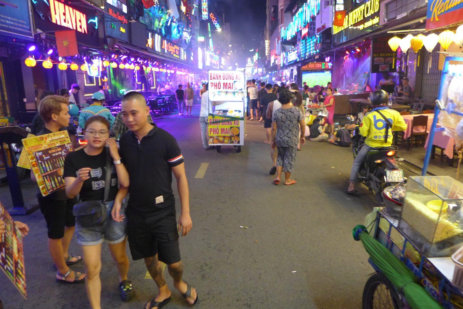 Bui Vien Walking Street lit up at night in Ho Chi Minh City