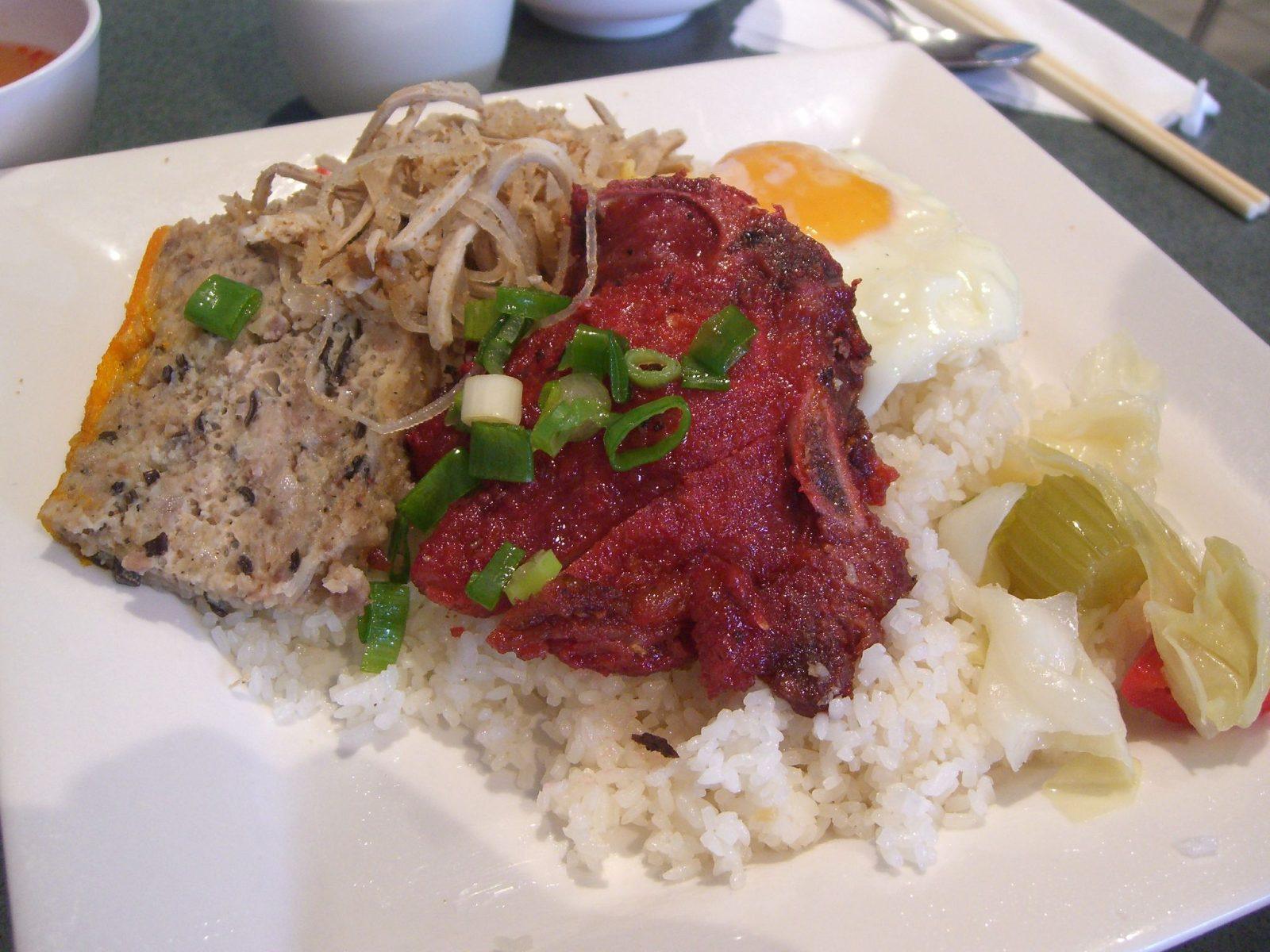 Com tam broken rice plate with grilled pork, a Saigon specialty
