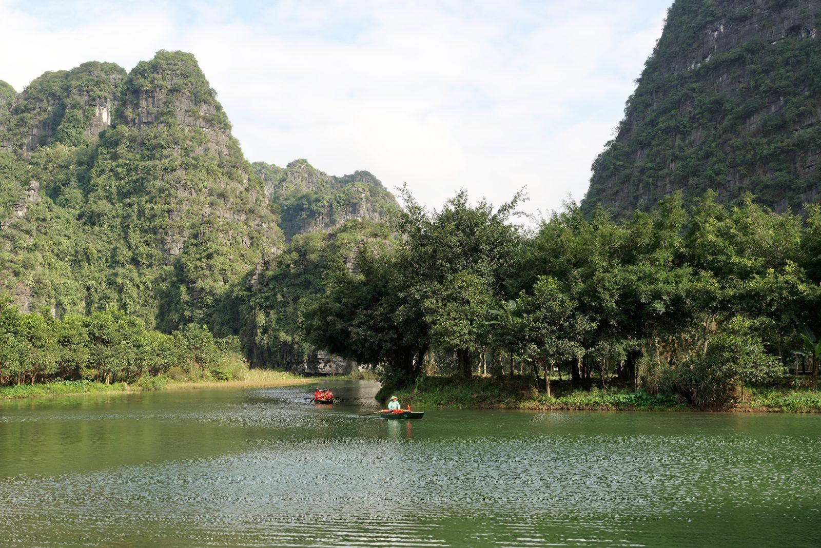 Sampan boat tour through the karst landscape of Trang An, Ninh Binh