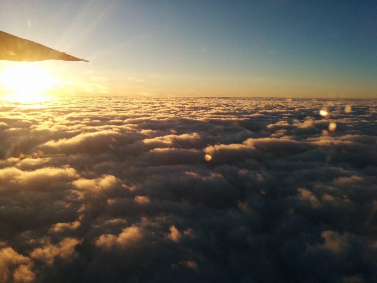 View above the clouds from an airplane window