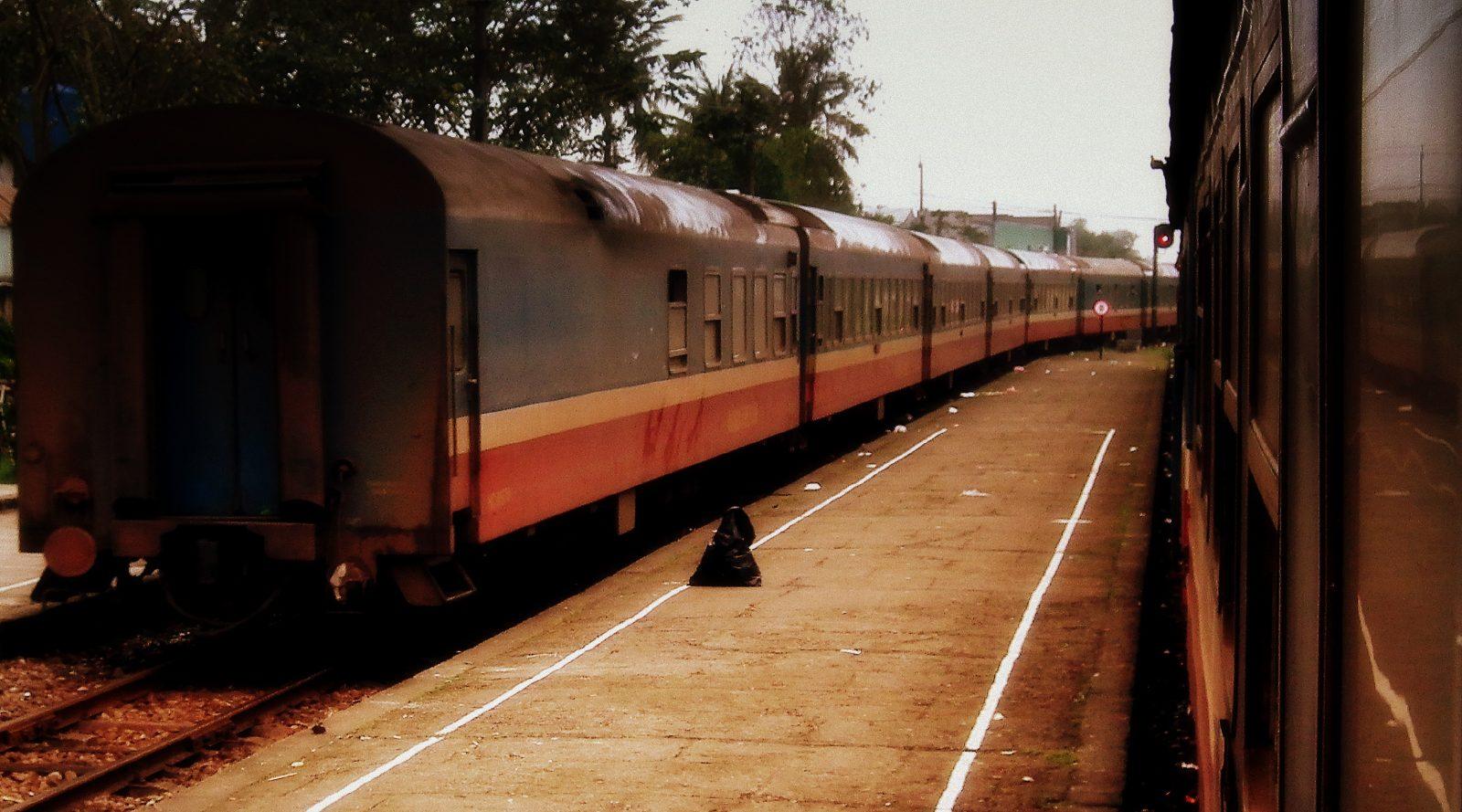 A Vietnam Railways Reunification Express train at a station platform