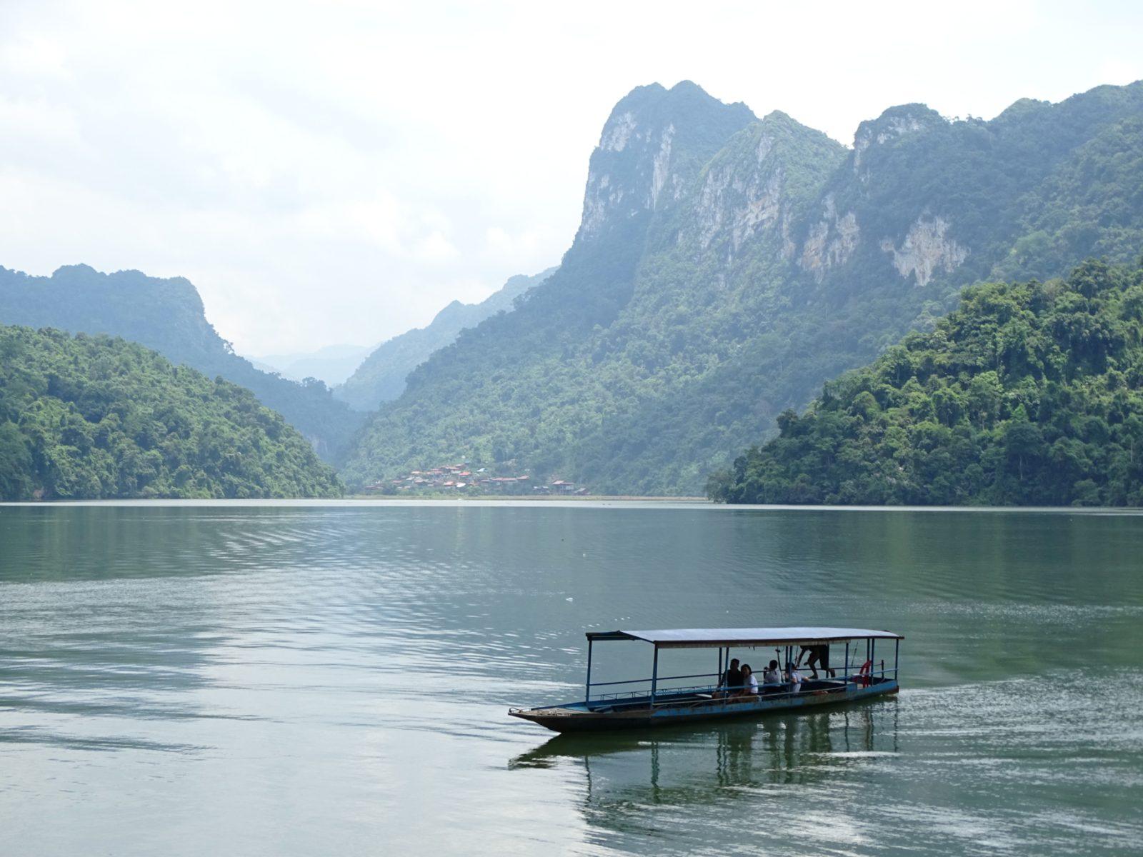 Another view of Ba Be Lake with forested limestone hills along the shoreline