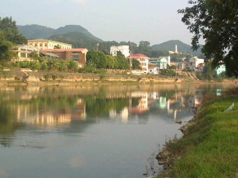 The Bang Giang River winding through Cao Bang city, framed by mountains