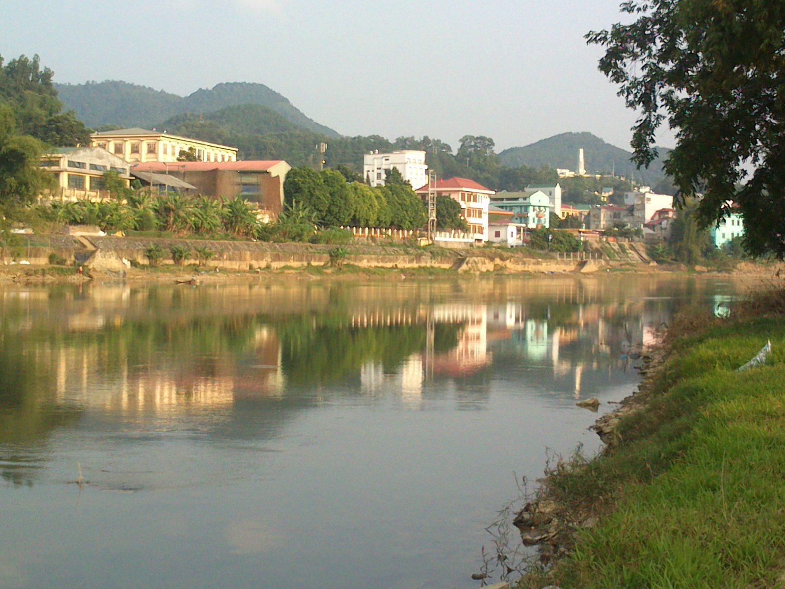 The Bang Giang River winding through Cao Bang city, framed by mountains