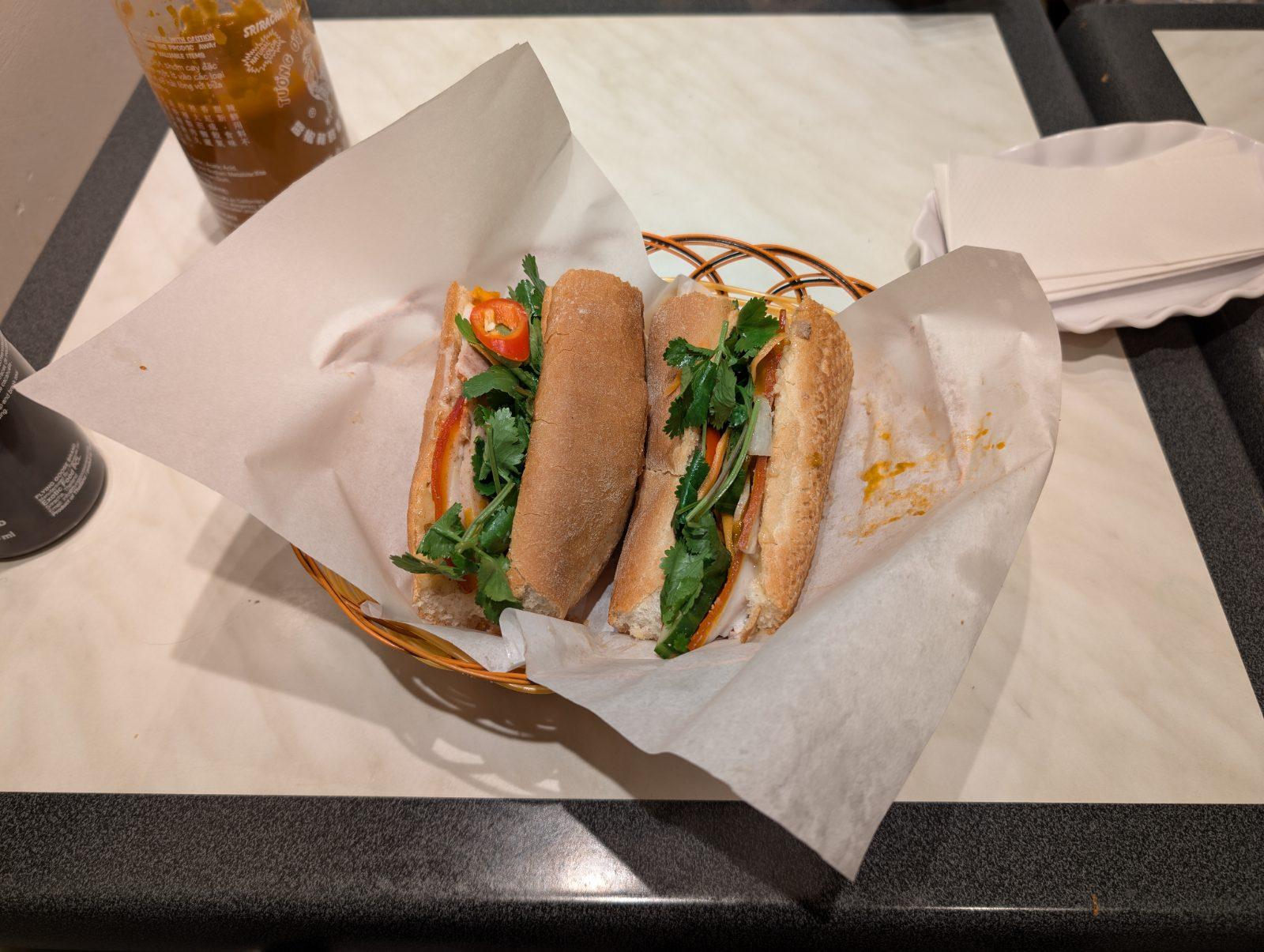 A classic Vietnamese banh mi sandwich with pate, pork, pickled vegetables and cilantro
