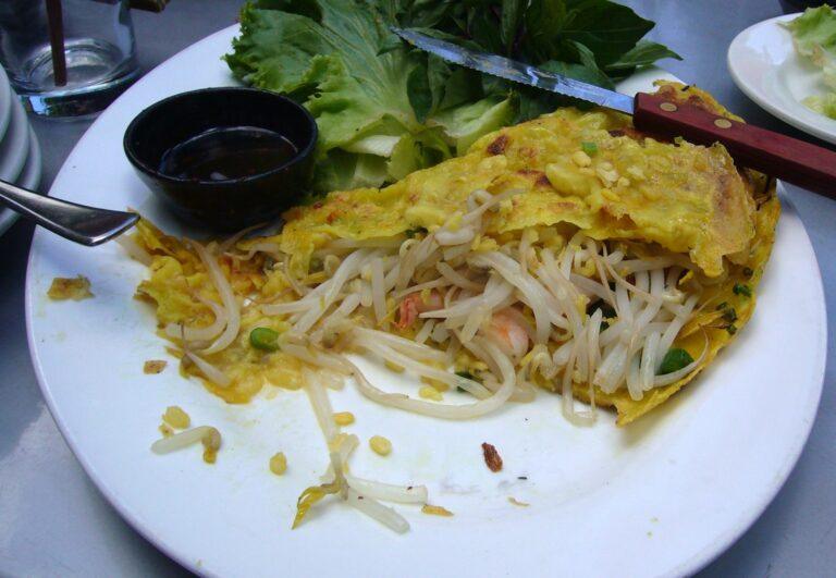 A crispy Vietnamese banh xeo pancake filled with shrimp and pork