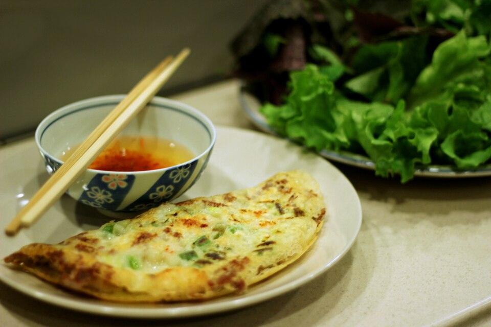 Banh xeo Vietnamese pancake served with nuoc mam dipping sauce