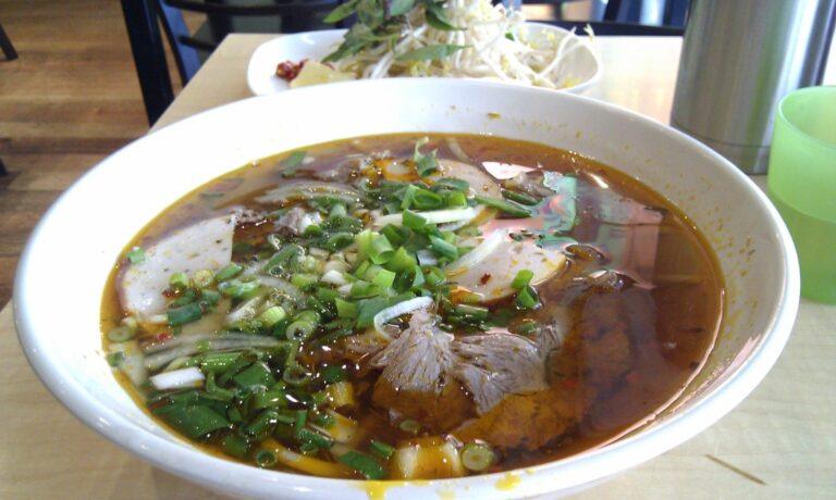 A bowl of bun bo Hue, the spicy beef and lemongrass noodle soup from Hue, Vietnam