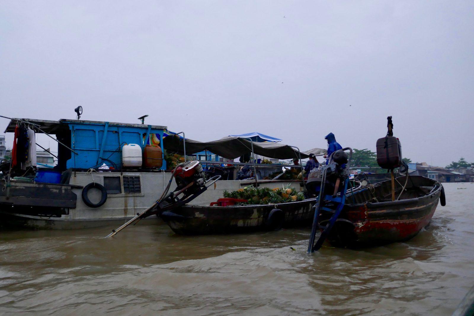 Boats loaded with produce at Cai Rang floating market near Can Tho, Vietnam