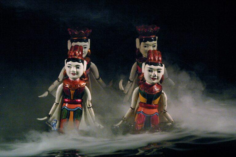 Traditional Vietnamese water puppets performing a scene on water in Hanoi