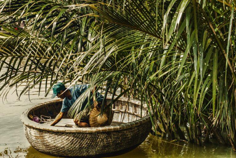 A traditional round basket boat on the water at Cam Thanh Coconut Village near Hoi An