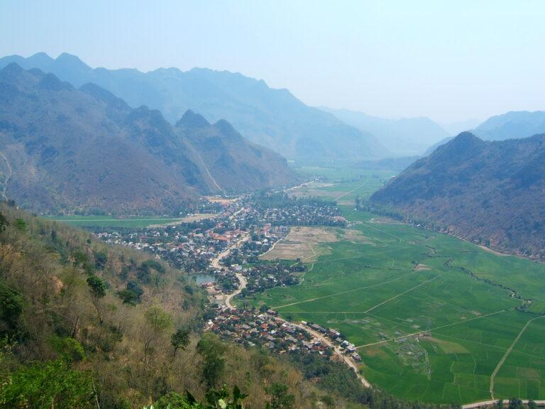 Aerial view of Mai Chau valley and rice fields surrounded by limestone mountains