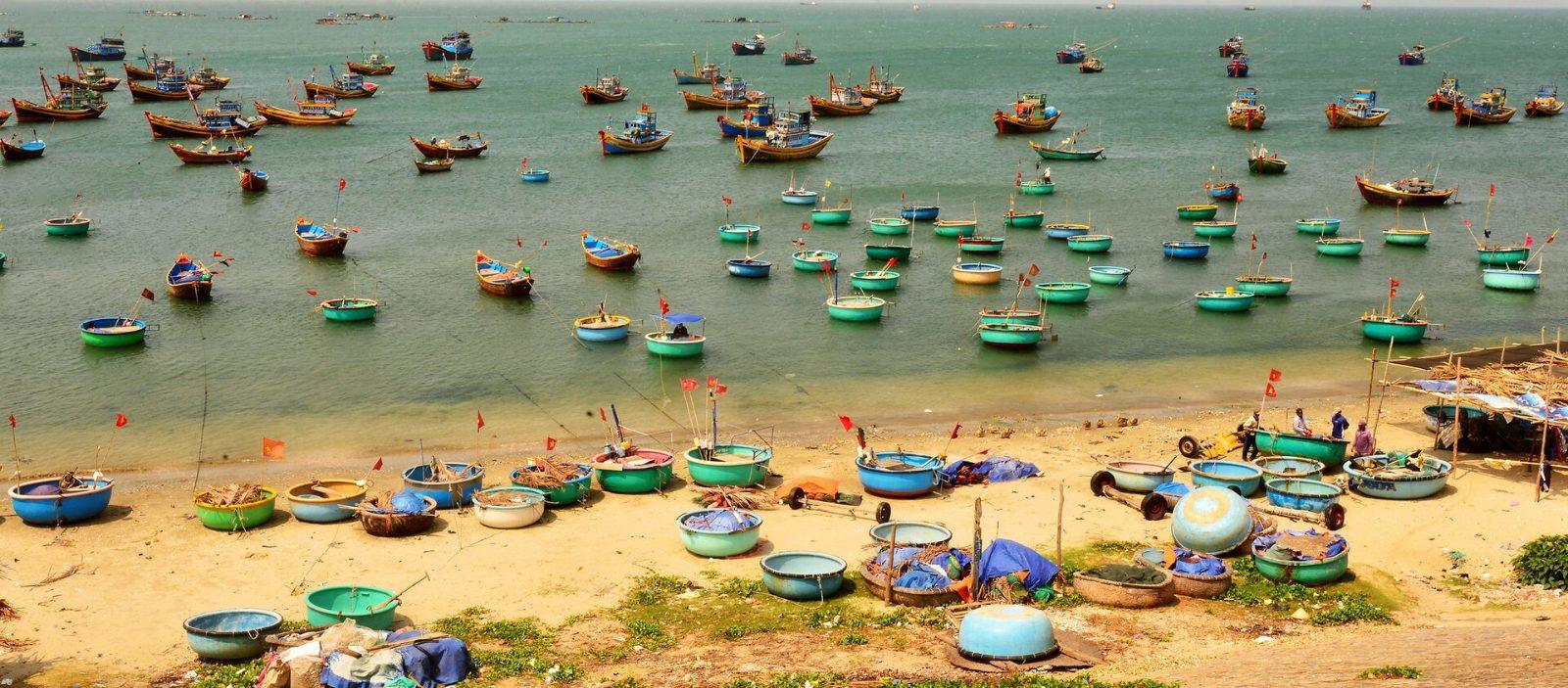 Traditional fishing boats in Mui Ne harbor