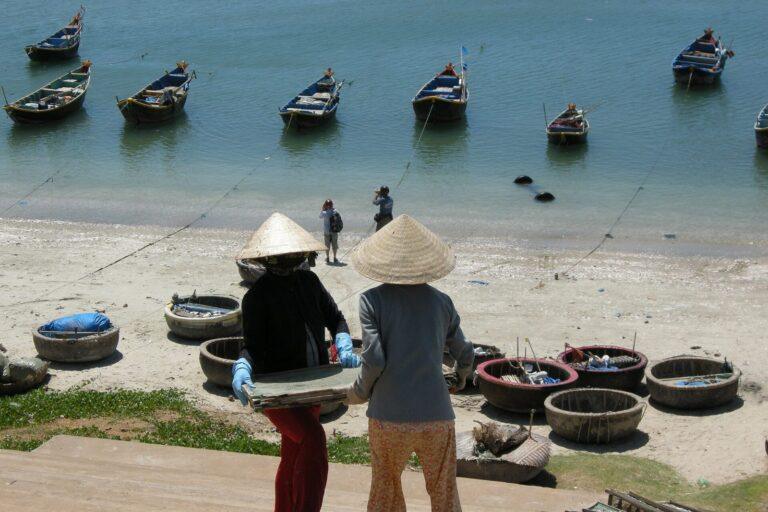 Local women sorting the morning catch at Mui Ne harbor