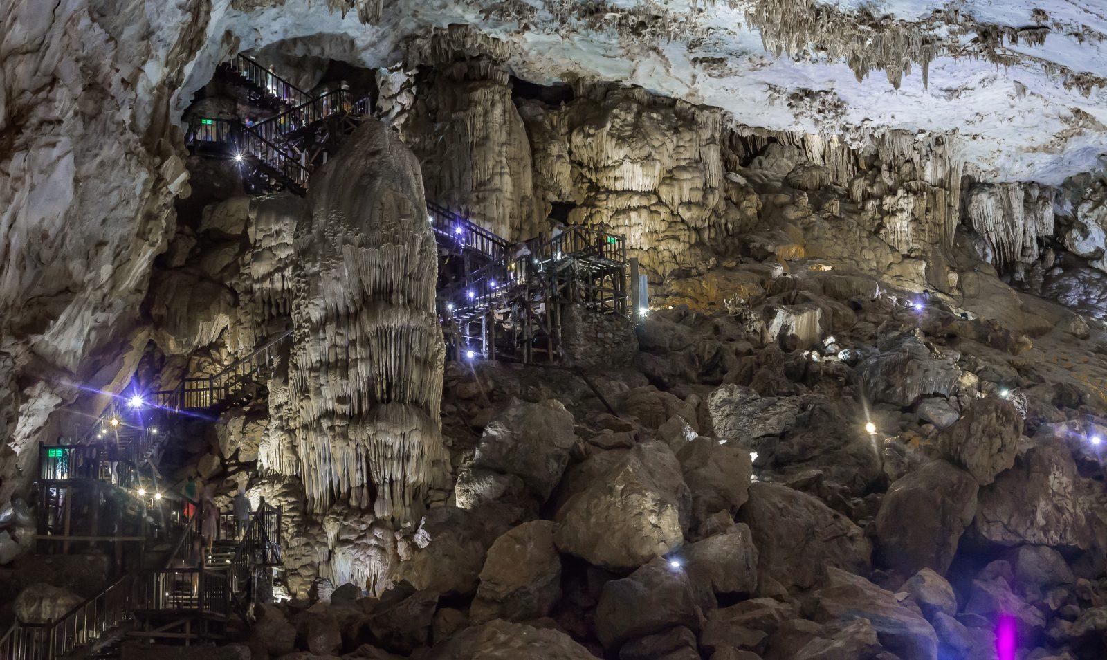 Illuminated stalactite formations inside Paradise Cave