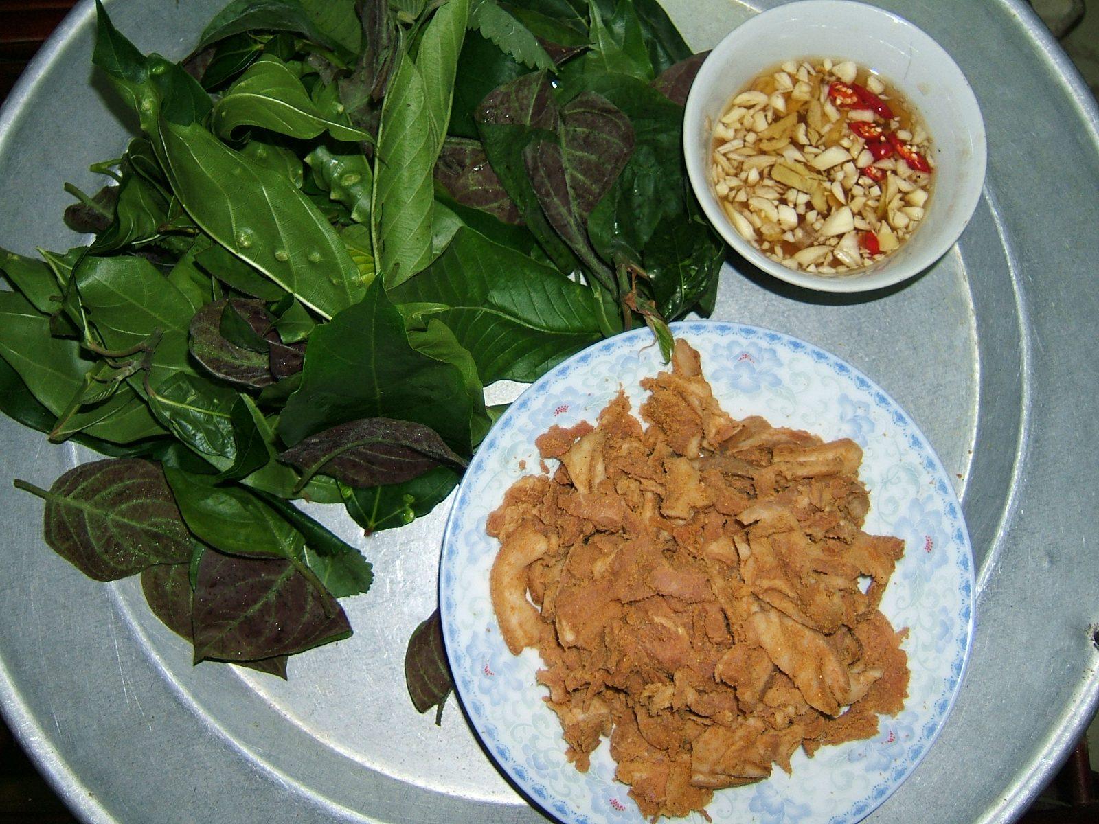 Thit chua, a fermented pork specialty from Vietnam northern highlands, served with wild herbs