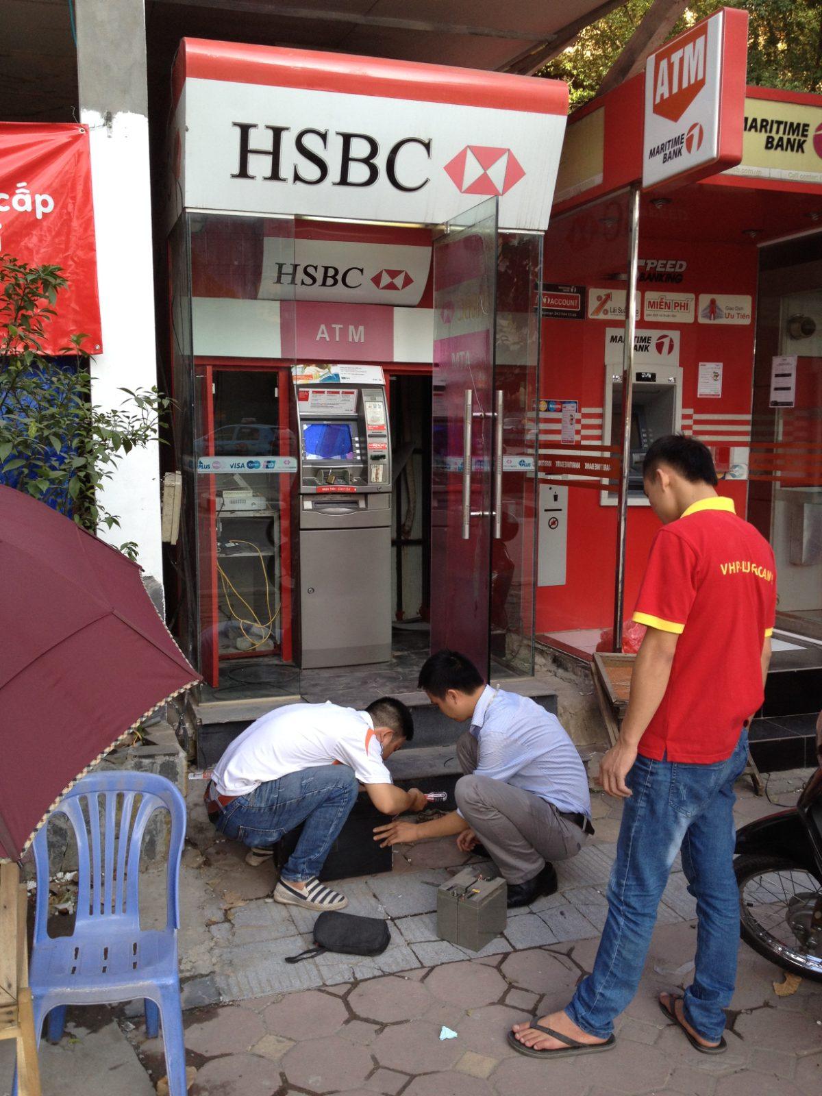 An HSBC ATM on a street in Hanoi, Vietnam