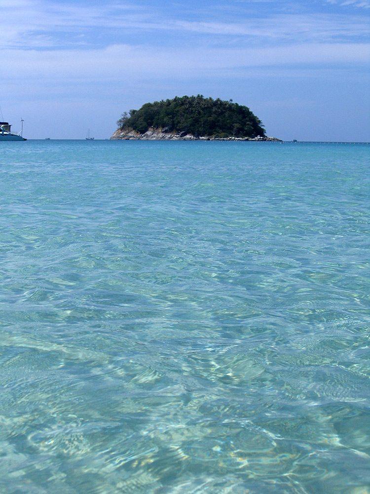 Clear turquoise water at Kata Beach with Koh Pu island offshore