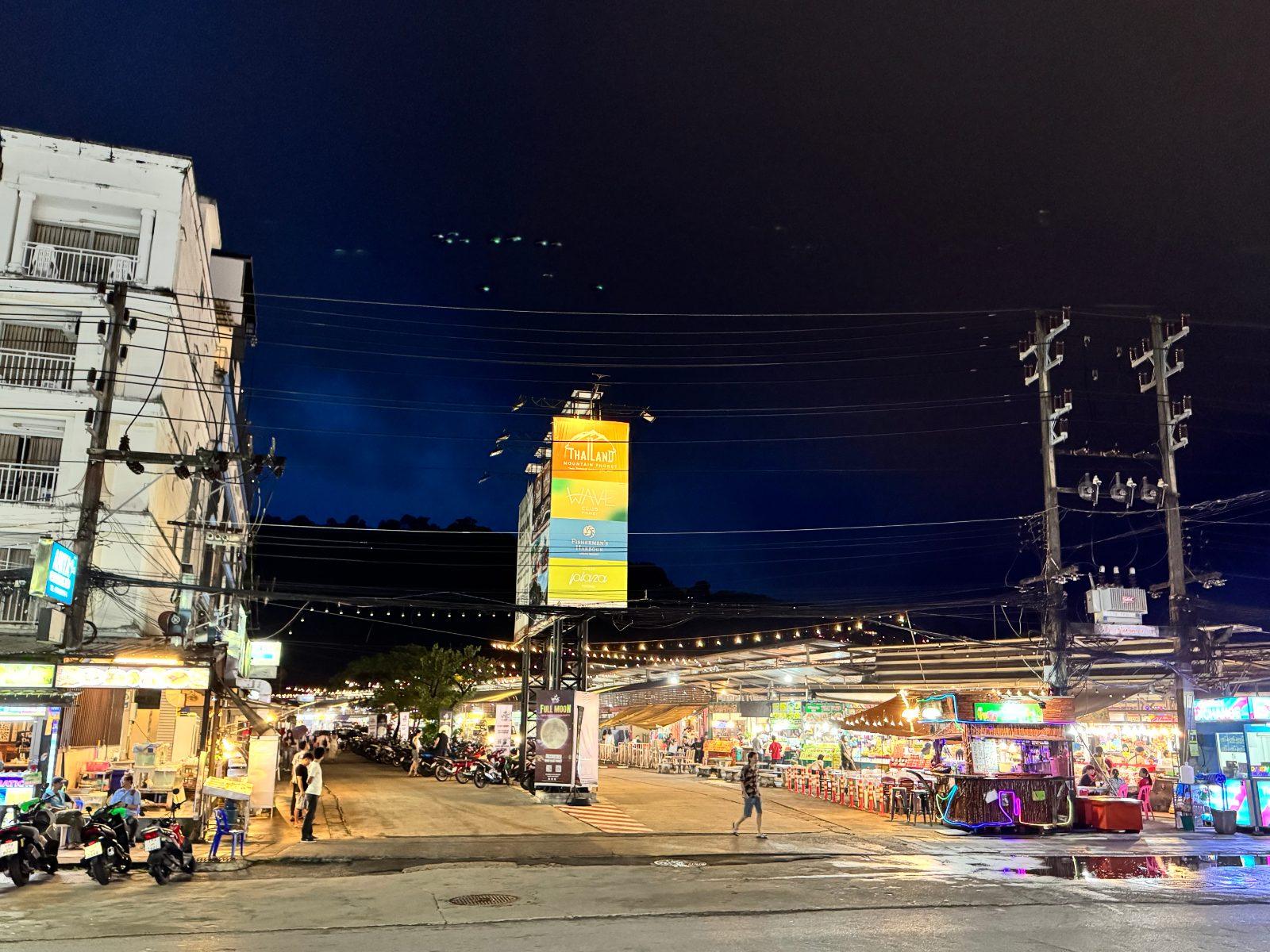 A lit-up street at Malin Plaza Night Market in Phuket after dark