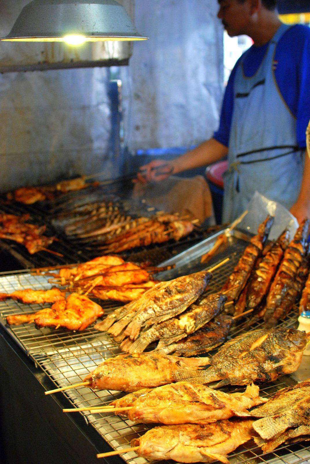 Grilled fish and seafood skewers at a Phuket market stall